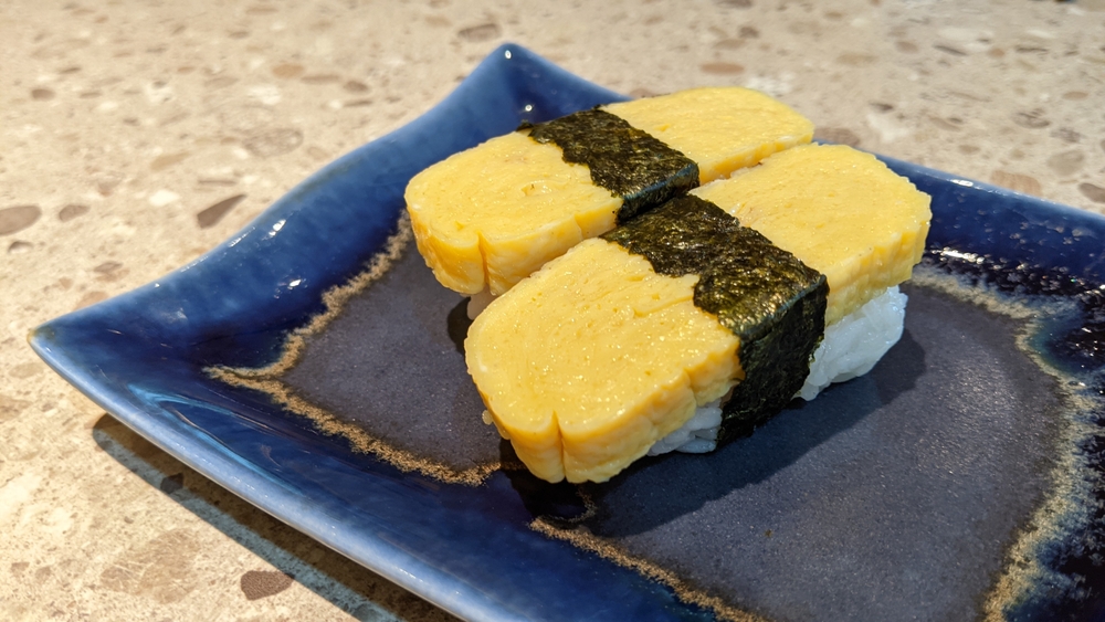 Two,Pieces,Of,Tamago,Sushi,Sweet,Japanese,Omelet,Atop,Vinegared